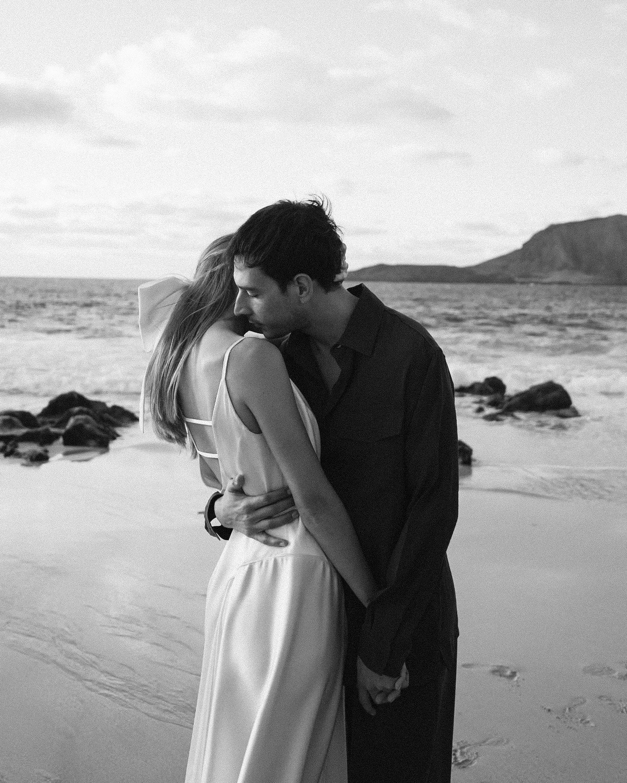 Cool couple hugging on the beach